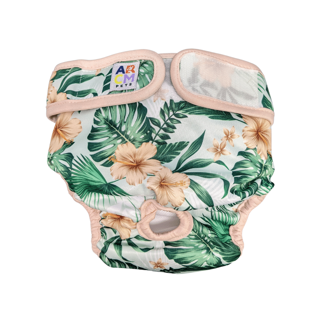 Tropical Bloom pet diaper featuring a vibrant hibiscus and tropical leaf pattern, designed for comfort, ultra-absorbency, IVDD safety, and leak-proof protection with adjustable Velcro closures and a tail hole for mobility.